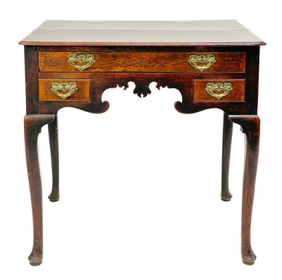 Lot 114 - A George III oak lowboy or side table.