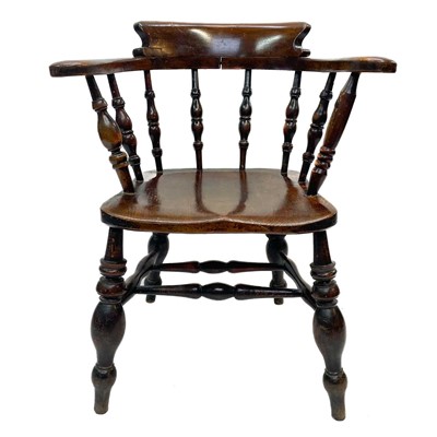 Lot 170 - A Victorian oak bow smokers chair.