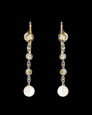 Lot 48 - An Edwardian elegant pair of diamond and pearl pendant earrings.