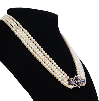 Lot 70 - An exquisite Art Deco four-row natural saltwater pearl choker with diamond and sapphire clasp.