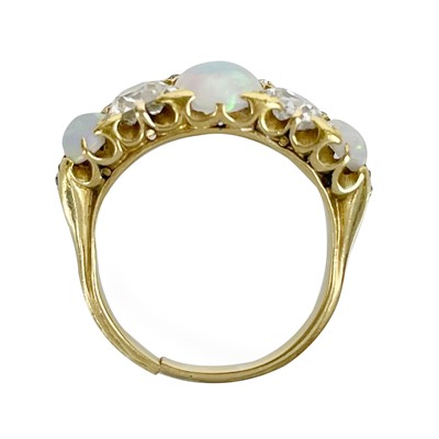 Lot 15 - A good 18ct gold diamond and opal five stone ring.
