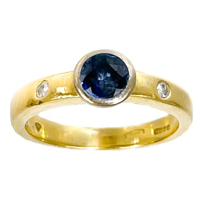 Lot 314 - A modern 18ct sapphire and diamond set ring.