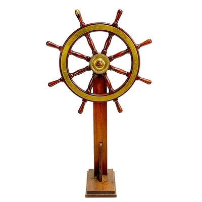 Lot 204 - A brass mounted teak ship's wheel.