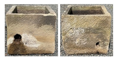 Lot 282 - A pair of sandstone square planters.