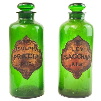 Lot 122 - A pair of 19th century green glass Pharmacy or Chemist jars and stoppers.