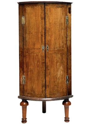 Lot 105 - A George III mahogany and chevron banded bow front corner cupboard.