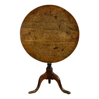 Lot 217 - A George III oak circular tripod table.