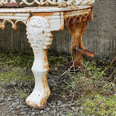 Lot 274 - A pair of mid 19th century cast iron garden benches.
