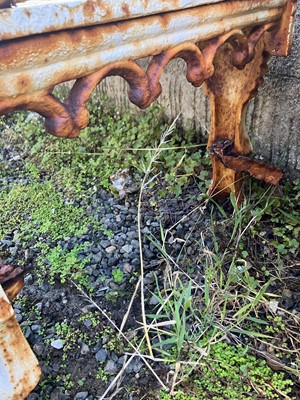 Lot 274 - A pair of mid 19th century cast iron garden benches.