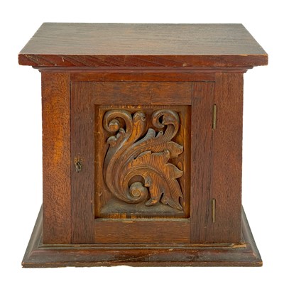 Lot 105 - An Arts and Crafts walnut collectors cabinet.