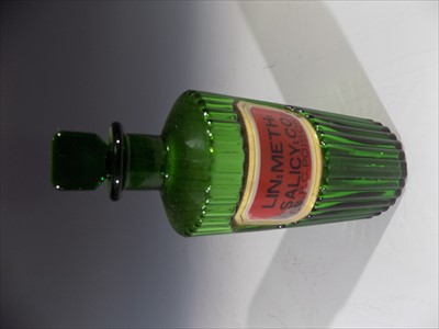 Lot 75 - A late 19th/early 20th century green glass...