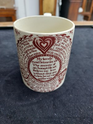 Lot 264 - A creamware sweetheart mug.