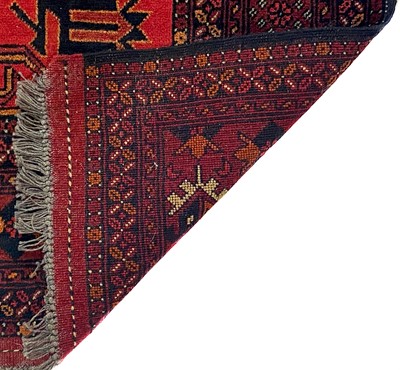 Lot 308 - An Afghan rug, mid 20th century.