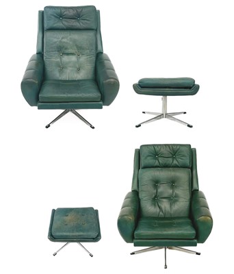 Lot 436 - A pair of green leather swivel armchairs and ottomans circa 1970.