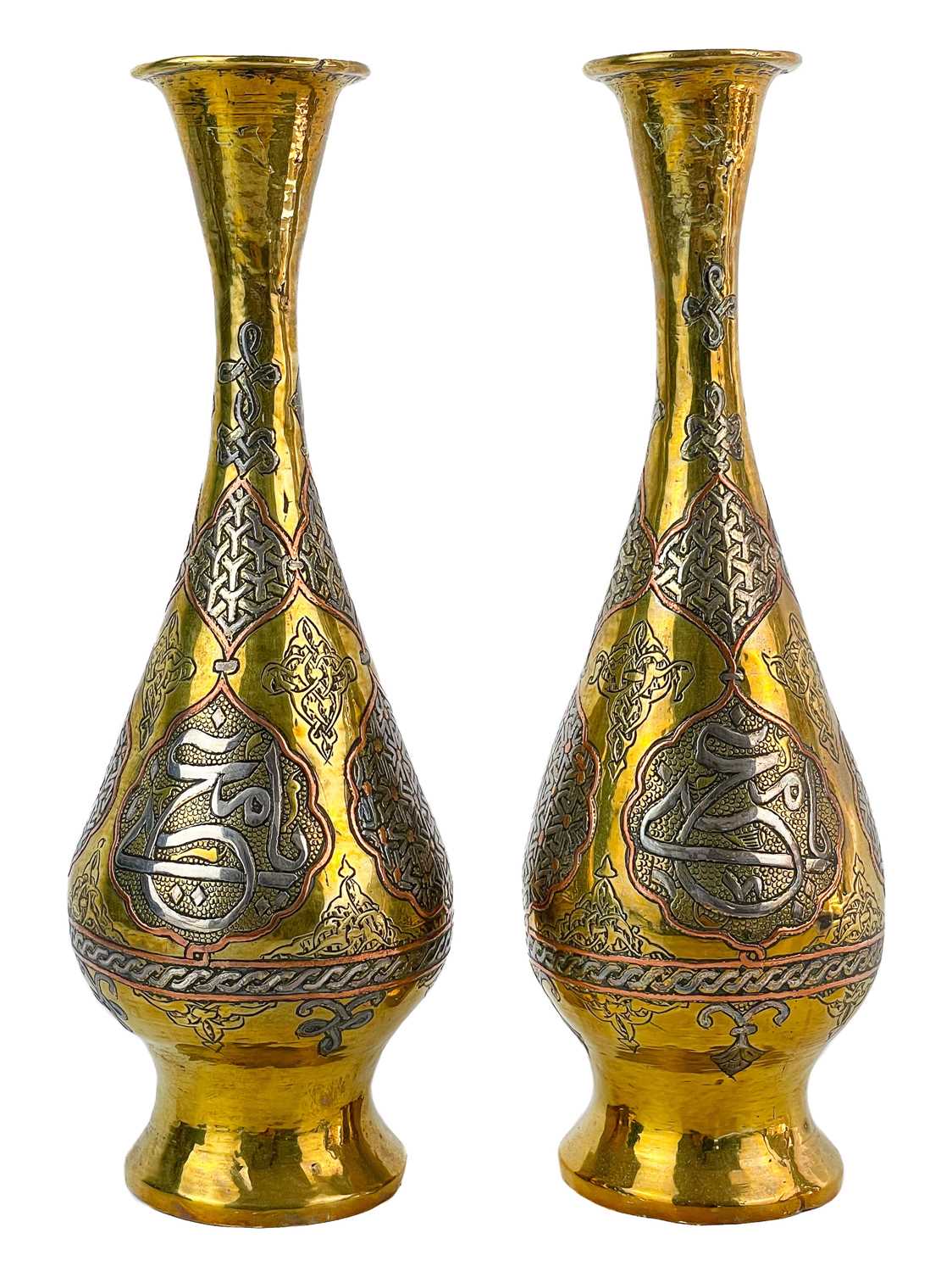 Lot 14 - A pair of Cairoware brass and silver inlaid vases, Egypt, 19th century.
