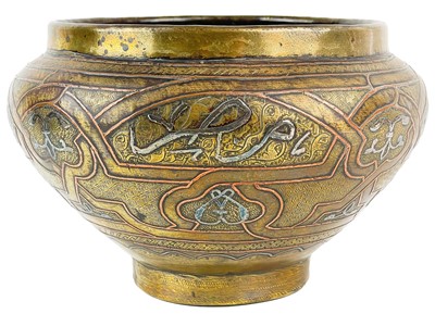 Lot 15 - A Cairoware brass and inlaid silver jardiniere, Egypt, circa 1900.