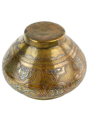 Lot 15 - A Cairoware brass and inlaid silver jardiniere, Egypt, circa 1900.