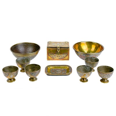 Lot 16 - A collection of ten Cairoware brass and silver inlaid items, circa 1900.