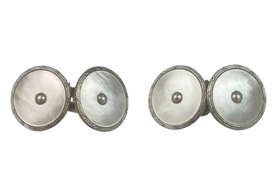 Lot 40 - A pair of 18ct and platinum mother-of-pearl and seed pearl cufflinks.