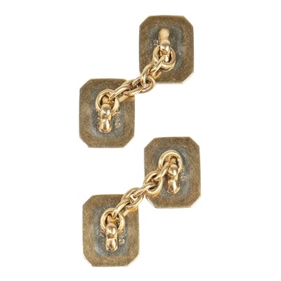 Lot 363 - A pair of 9ct white and yellow gold engine turned cufflinks.
