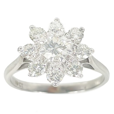 Lot 225 - An 18ct white gold diamond set daisy ring.