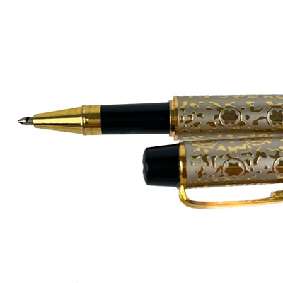 Lot 243 - A Mont Blanc rollerball pen with silver and gold plated case with violin neck clip.