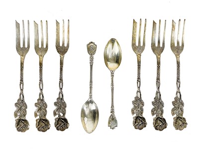 Lot 111 - A set of six 835 silver cake forks with rose cast handles.