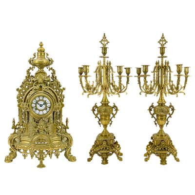 Lot 359 - An ornate Continental brass clock garniture.