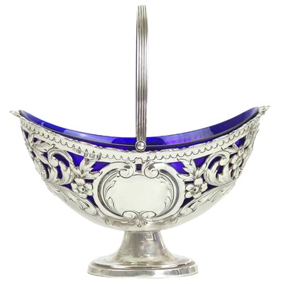 Lot 196 - An Edwardian silver pedestal swing handled sweetmeat dish by Charles Westwood.