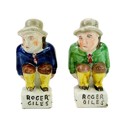 Lot 268 - Two Staffordshire figures of Roger Giles.