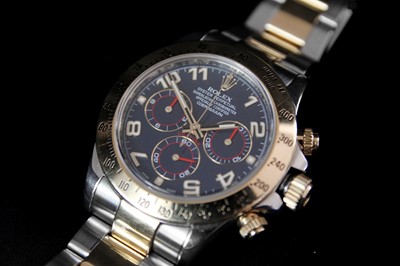 Lot 475 - Rolex - A Rolex Cosmograph Daytona 18ct gold and steel gentleman's bracelet wristwatch, ref. 116523.