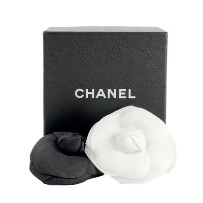 Lot 525 - Two 1980s Chanel camellia fabric flower brooches.