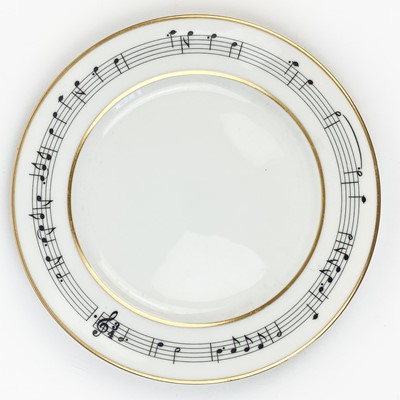 Lot 536 - A Tiffany & Co 1994 Henry Mancini 'Moon River' demitasse tea cup, saucer and plate set.