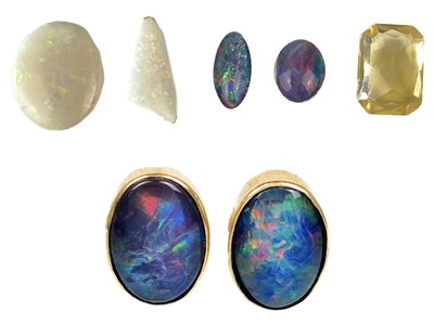 Lot 233 - Two unmounted white opals of 6.5ct, three triplet black opals, a citrine & pair of gold opal earrings.