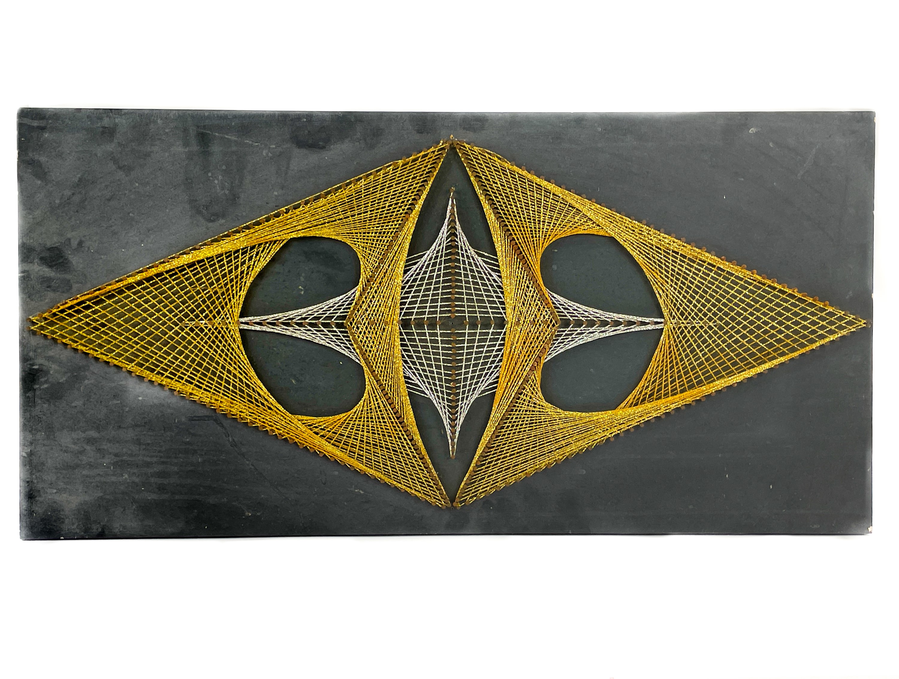 Geometric String Rat Lot 81 - A 1970s geometric string art work.