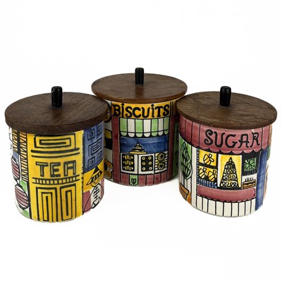 Lot 543 - A set of three ceramic canisters with teak covers by ANITA NYLUND for Jie of Sweden.