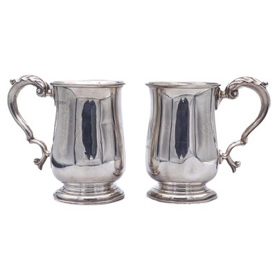 Lot 213 - A pair of George V silver George III style baluster mugs by Bravingtons Ltd.