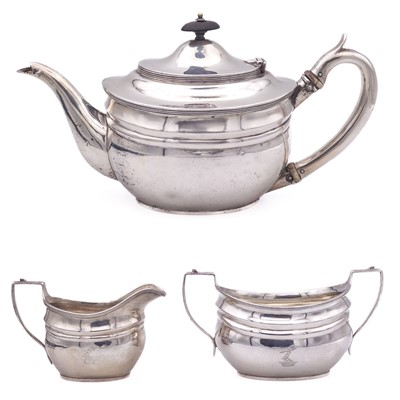 Lot 218 - An Edwardian silver three piece teaset by C S Harris & Sons Ltd.