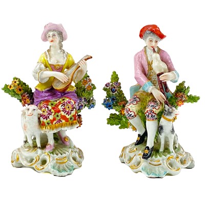 Lot 276 - A pair of Continental porcelain gold anchor figures of Musicians.