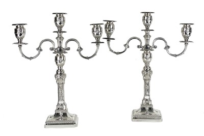 Lot 229 - An impressive pair of modern Neo-Classical style filled silver three-branch candelabra.