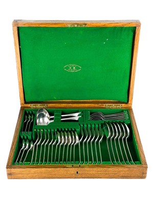 Lot 88A - A George V silver six-setting canteen of cutlery in a fitted oak box by Joseph Rogers & Sons.