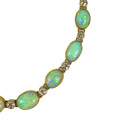 Lot 94 - An attractive early 20th century gold, diamond and blue opal set bracelet.