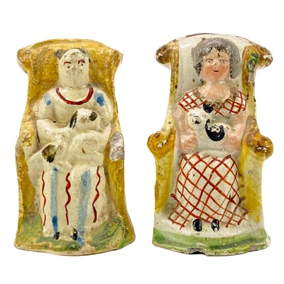 Lot 252 - A pair of unusual Staffordshire pearlware figures.