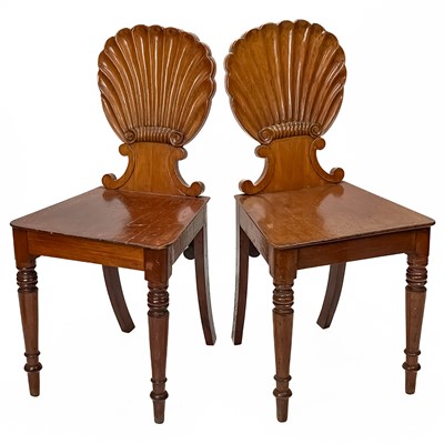 Lot 246 - A pair of Victorian mahogany shell back hall chairs.