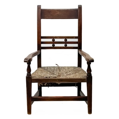 Lot 1203 - A 19th century fruitwood child's armchair.