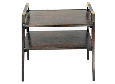 Lot 385 - An Arts and Crafts oak brass bound two tier side table/dumb waiter.