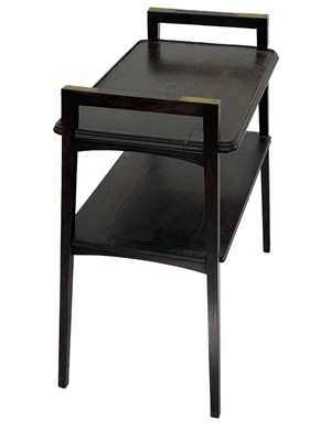 Lot 385 - An Arts and Crafts oak brass bound two tier side table/dumb waiter.