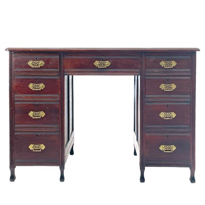 Lot 422 - An Arts and Crafts mahogany fixed pedestal desk.