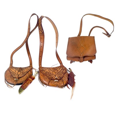 Lot 184 - A handmade leather bag with tooled detail.