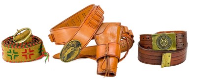 Lot 221 - A handmade leather cartridge belt with attached gun holster.